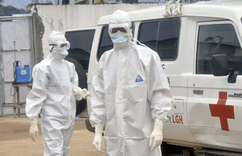 Ebola health workers wearing protective gear in Monrovia, Liberia, in October.