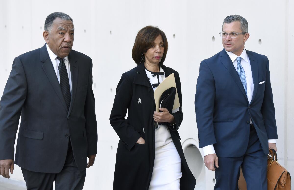 Former Baltimore Mayor Catherine Pugh arrives Feb. 27 for a sentencing hearing with attorney Steven Silverman, right.