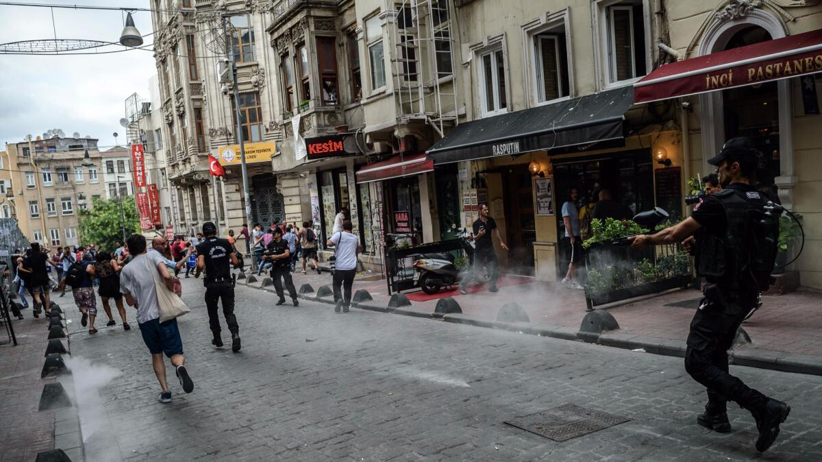 Turkish anti riot police fire rubber bullets to disperse demonstrators gathered for a rally staged by the LGBT community in Istanbul on June 26, 2016.
