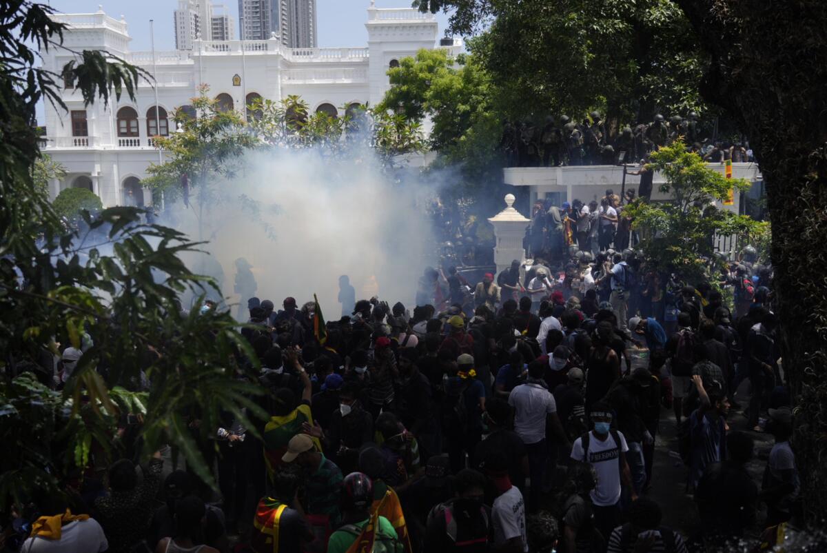 Tear gas billowing amid crowd of protesters in Colombo, Sri Lanka