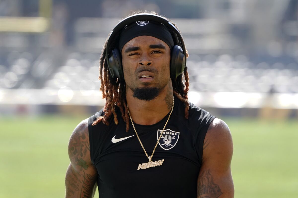 FILE - Las Vegas Raiders cornerback Damon Arnette warms up before an NFL football game against the Pittsburgh Steelers, Sunday, Sept. 19, 2020, in Pittsburgh. The Las Vegas Raiders waived 2020 first-round pick Damon Arnette and have now cut ties with both first-round picks from that draft before the midpoint of their second season. General manager Mike Mayock called it a “painful decision” to release Arnette on Monday, Nov. 8, 2021, but said it was necessary in response to a social media post with Arnette brandishing a gun and threatening to kill someone. (AP Photo/Keith Srakocic, File)