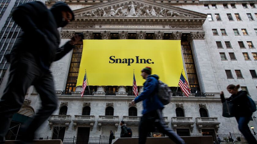 Signage for Snap Inc., parent company of Snapchat, adorns the front of the New York Stock Exchange in 2017.
