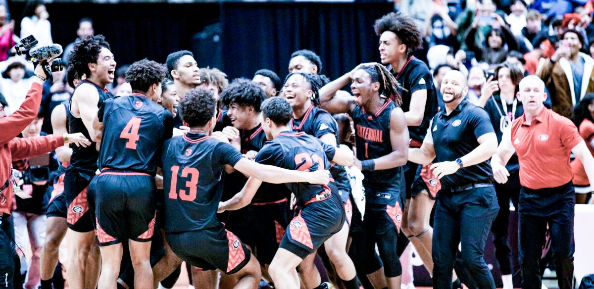Corona Centennial players and coaches celebrate