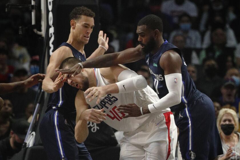 LOS ANGELES, CA - NOVEMBER 21, 2021: Clippers Ivica Zubac gets fouled by Mavericks Tim Hardaway Jr.