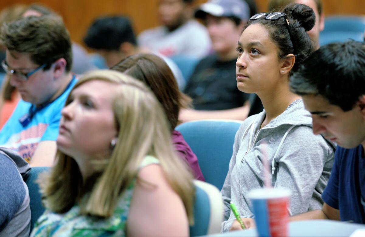 Somer Gaines listens during a Classical Mythology lecture on Monday, Aug. 24, at the Love Library in Lincoln, Neb.