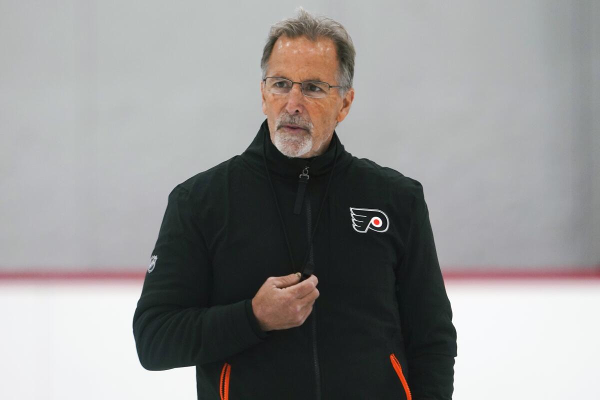 FILE - Philadelphia Flyers' coach John Tortorella looks on during training camp at the NHL hockey team's practice facility, Thursday, Sept. 22, 2022, in Voorhees, N.J. Tortorella could have jumped back into broadcasting or waited out a job opening for a team with talent. Instead, he took the job at Philadelphia, a once-proud franchise largely expected this week to open its worst season in team history. (AP Photo/Matt Rourke, File)