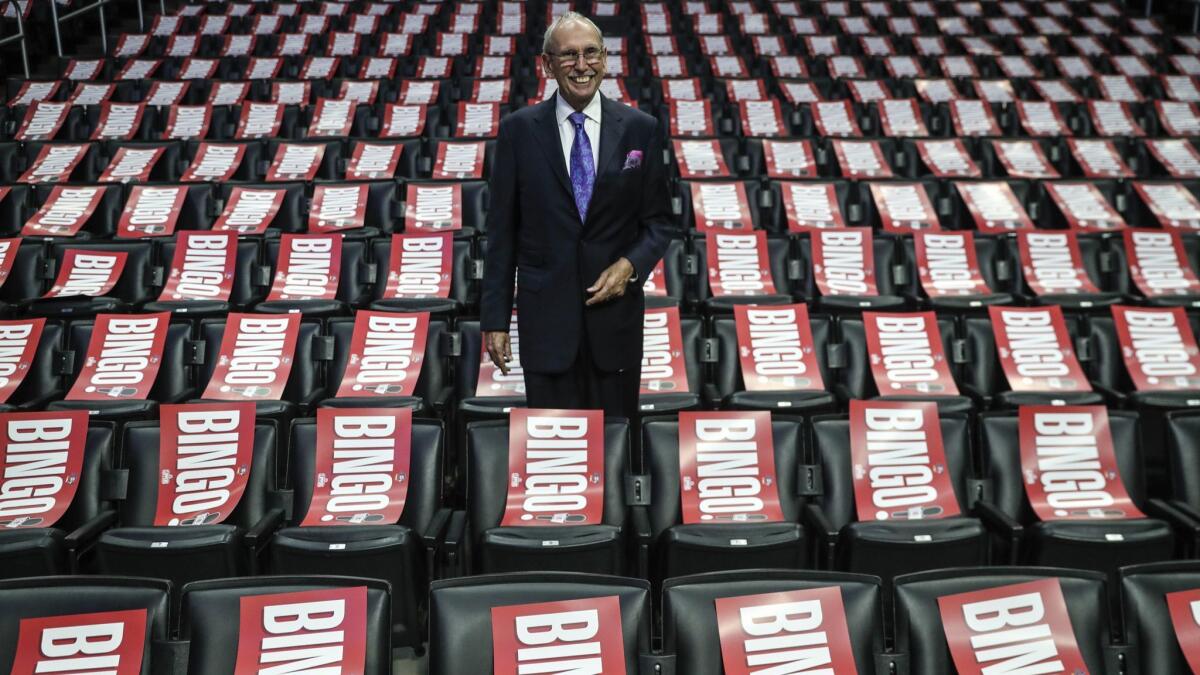 Clippers broadcaster Ralph Lawler poses for photos amid a sea of pladards of his signature "Bingo" as he is set to broadcast his final regular season game after 40 years.