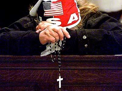 Florina Martinez prays during a Mass at St. Patrick's Cathedral