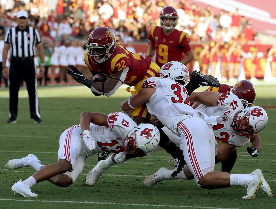 USC tailback Darwin Barlow fights for extra yardage against Utah