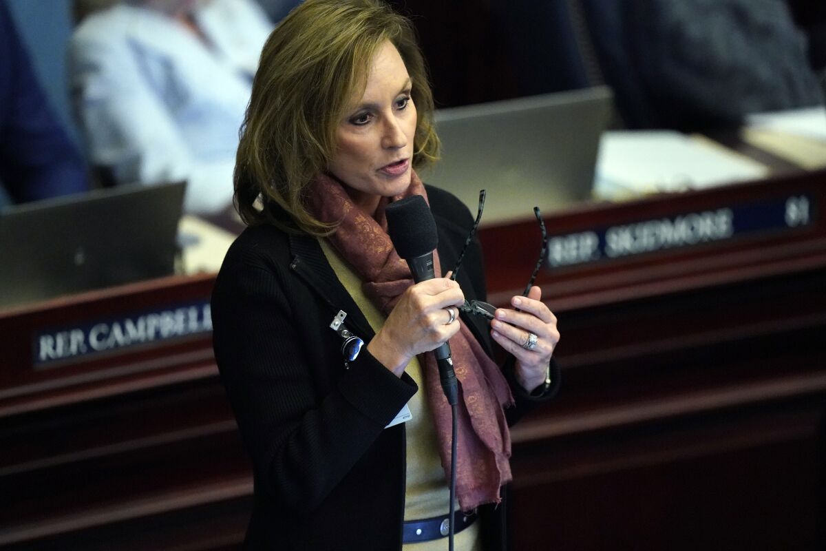 State Rep. Allison Tant speaks on a bill during a legislative session at the Florida State Capitol, Wednesday, March 9, 2022, in Tallahassee, Fla. Florida lawmakers are set to pass a voting law package that would create a police force dedicated to pursuing election crimes, a priority of Republican Gov. Ron DeSantis. (AP Photo/Wilfredo Lee)