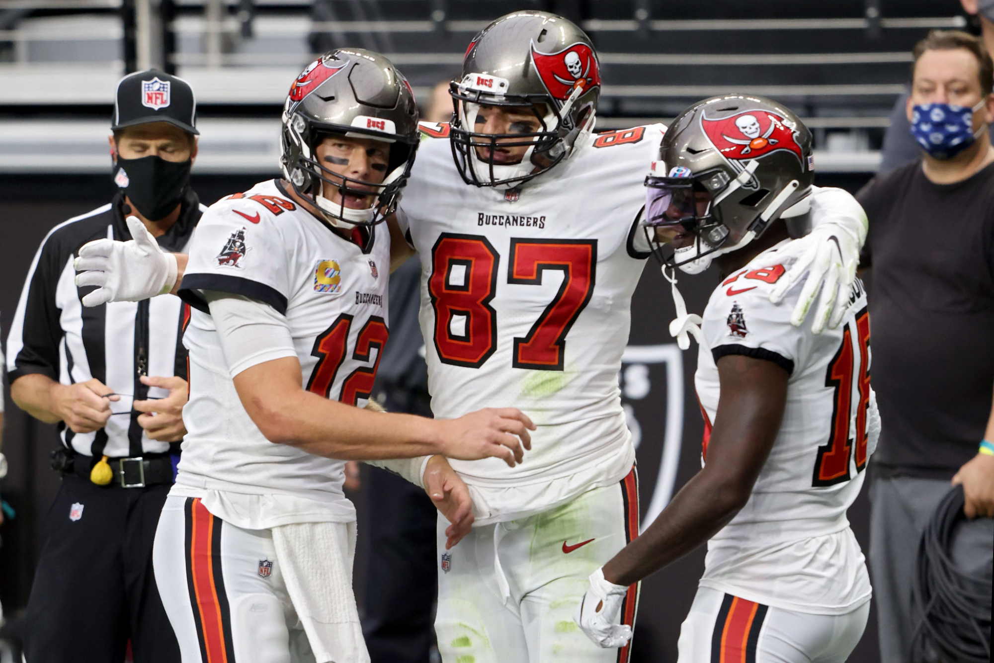 Tampa Bay Buccaneers teammates (from left) Tom Brady, Rob Gronkowski and Tyler Johnson celebrate a touchdown.