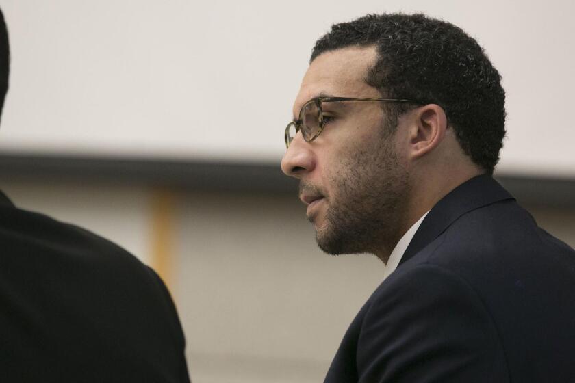 Former NFL football player Kellen Winslow Jr. looks at attorney Marc Carlos during his rape trial, Monday, May 20, 2019, in Vista, Calif. (John Gibbins/The San Diego Union-Tribune via AP, Pool)