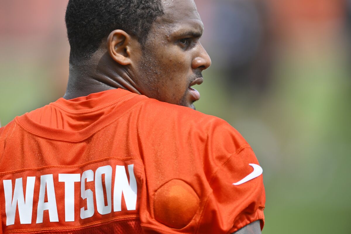 Cleveland Browns quarterback Deshaun Watson stands on the field during an NFL football practice at the team's training facility Wednesday, June 1, 2022, in Berea, Ohio. (AP Photo/David Richard)