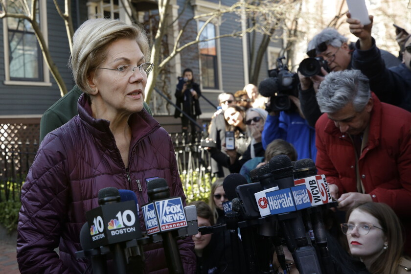 Sen. Elizabeth Warren speaks to reporters in 2020.