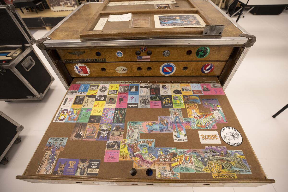 A wooden work desk decorated with colorful stickers
