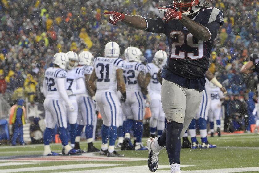 New England running back LeGarrette Blount celebrates one of his three touchdown carries against Indianapolis in the AFC Championship game Jan. 11 after being cut by Pittsburgh in November.