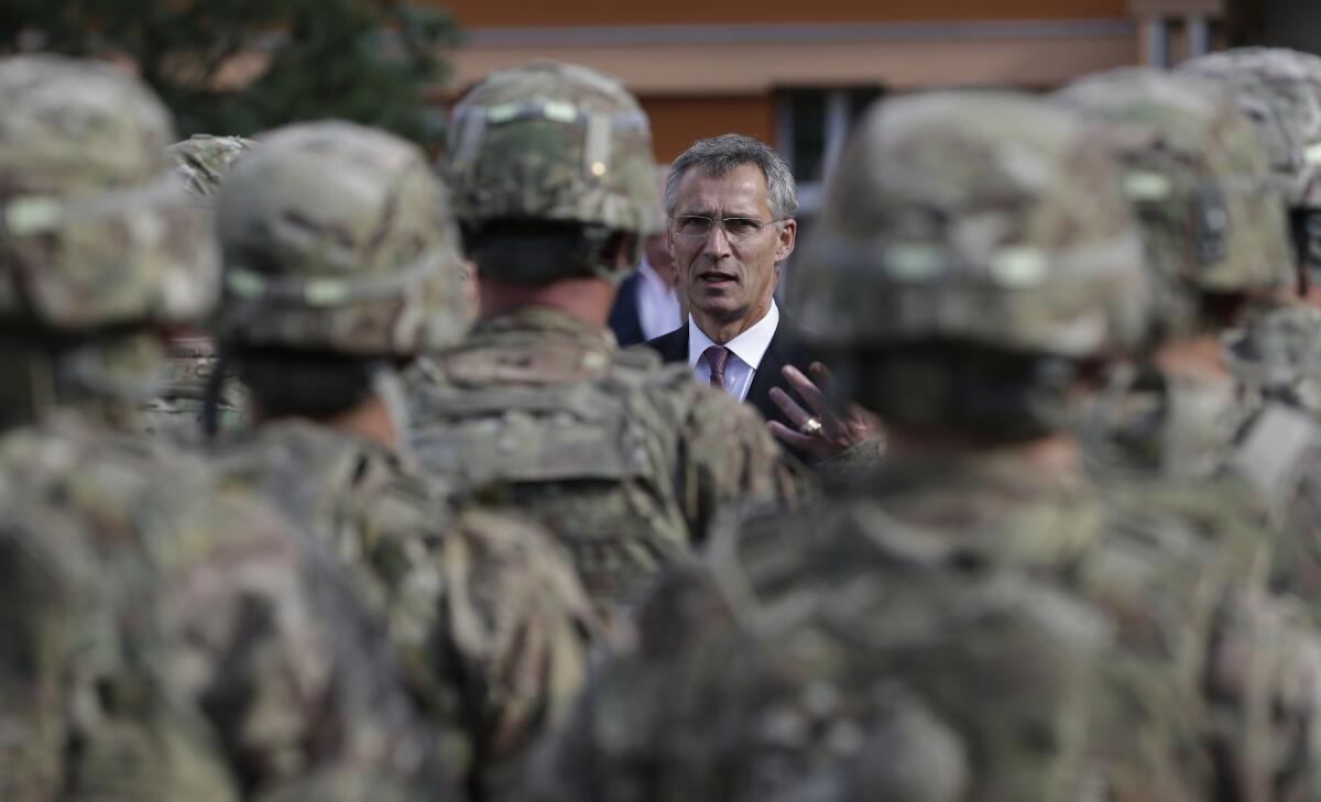 NATO Secretary General Jens Stoltenberg talks to U.S. army soldiers in Prague, Czech Republic