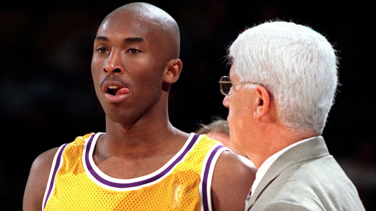 Laker rookie Kobe Bryant, 18, listens to coach Del Harris during a break in a 129-99 victory over the Washington Bullets at the Forum. Bryant scored 13 points.