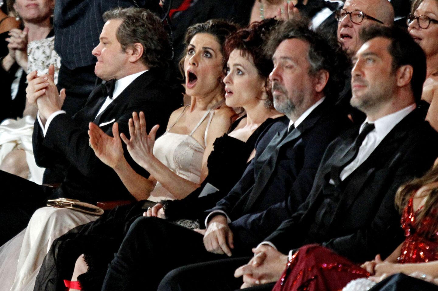 Actor Colin Firth and his wife, Livia Giuggioli, react after Tom Hooper wins best director for "The King's Speech," at the 83rd Academy Awards.