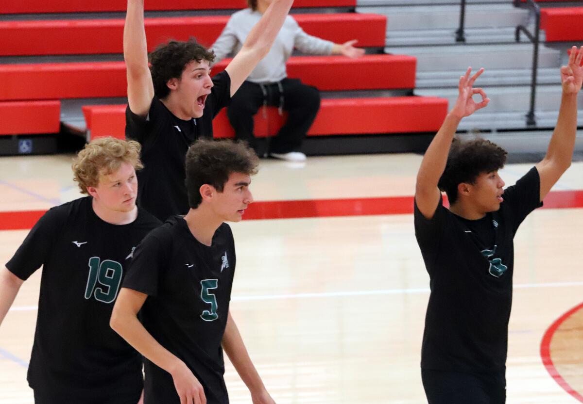 The Sage Hill boys' volleyball team celebrates a point against Fullerton in a CIF Southern Section Division 5 playoff match.