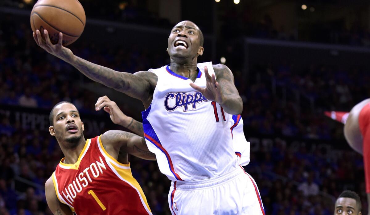 Clippers guard Jamal Crawford beats Rockets forward Trevor Ariza for a basket in the first half of Game 3.