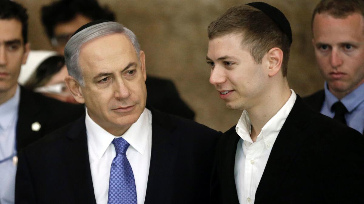 Israeli Prime Minister Benjamin Netanyahu and son Yair, right, at the Western Wall in Jerusalem on March 18, 2015.
