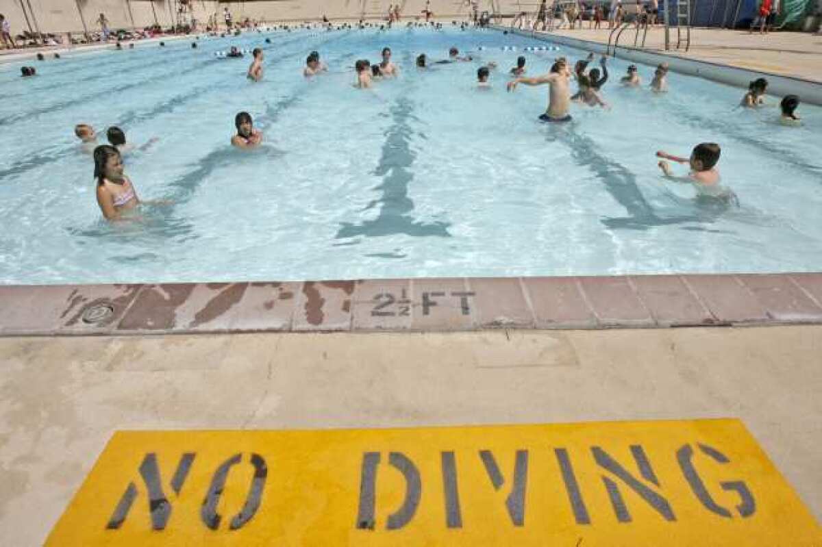 Swimmers enjoy a cool dip in the McCambridge swimming pool. Burbank was awarded a $7,000 grant Tuesday that will offset the cost of swimming classes, lifeguard lessons and events.