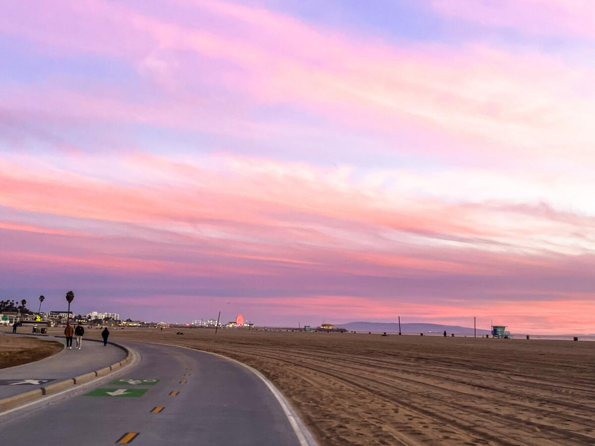 Pink sunset clouds over the Santa Monica bike path.