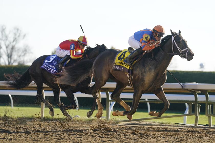 Irad Ortiz Jr. rides Forte to victory past Juan Hernandez on Cave Rock during the Breeders' Cup Juvenile raceat the Keenelend Race Course, Friday, Nov. 4, 2022, in Lexington, Ky. (AP Photo/Darron Cummings)