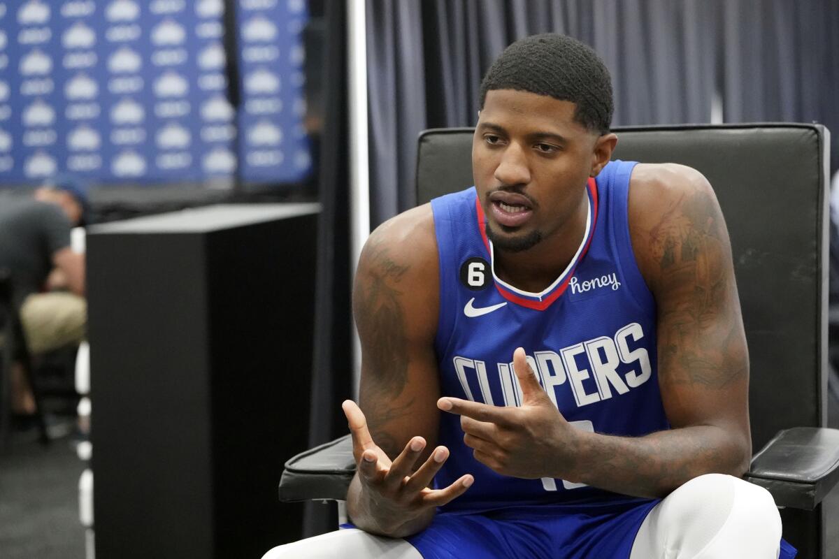 Clippers guard Paul George fields questions during the team's media day.