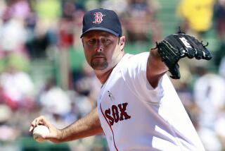 Boston Red Sox's Tim Wakefield pitches in the first inning of an interleague baseball game.