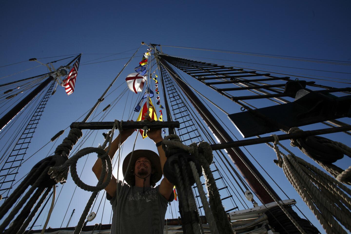 Zac Butko runs flags up the masts on the Bill of Rights tall ship before taking out a group of students from Channel Islands High School.