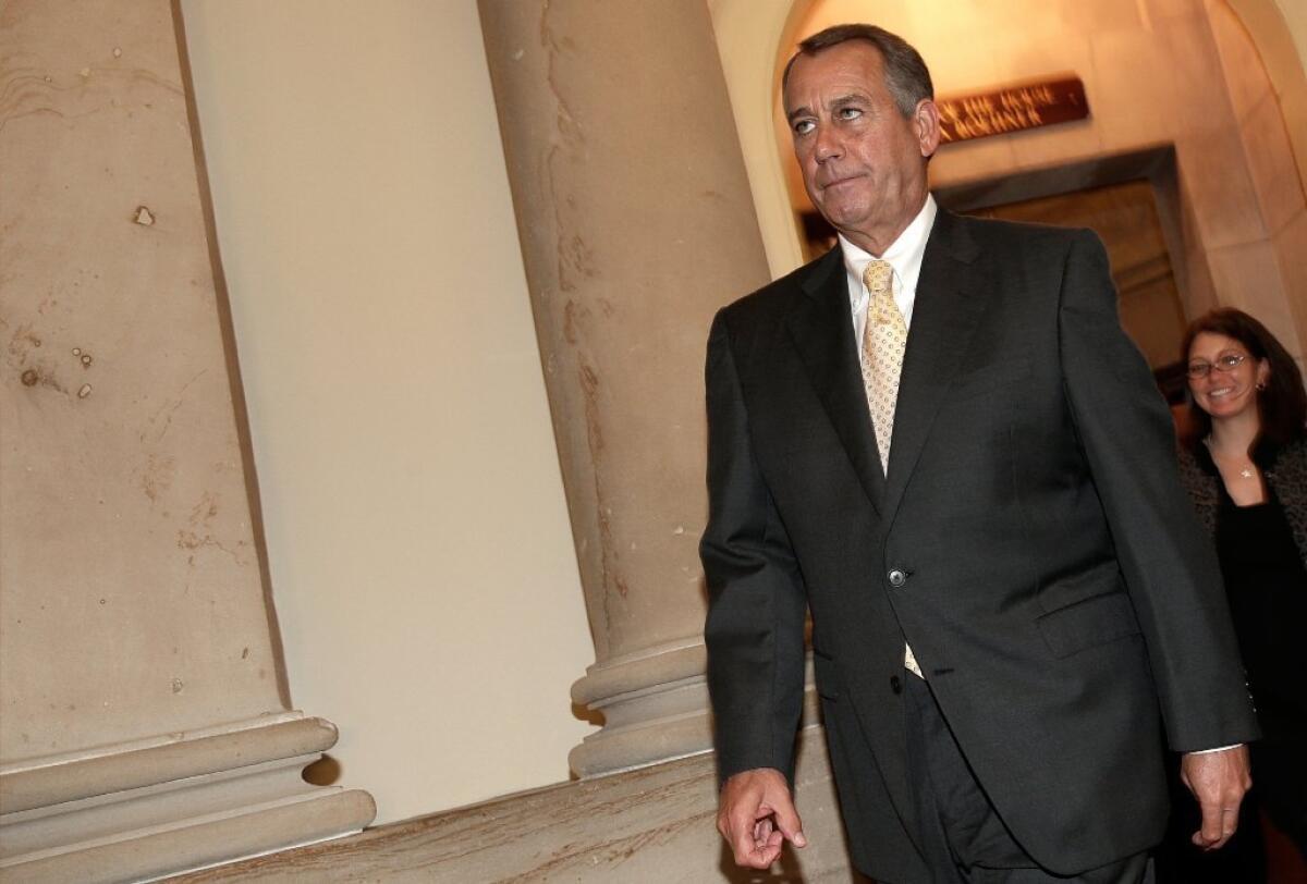 House Speaker John Boehner (R-Ohio) walks to the House floor on Thursday for a vote on legislation to partially fund some operations of the federal government.