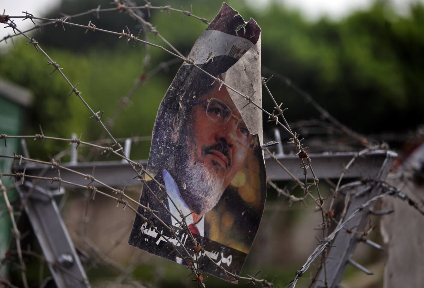 July 9: Poster of Morsi