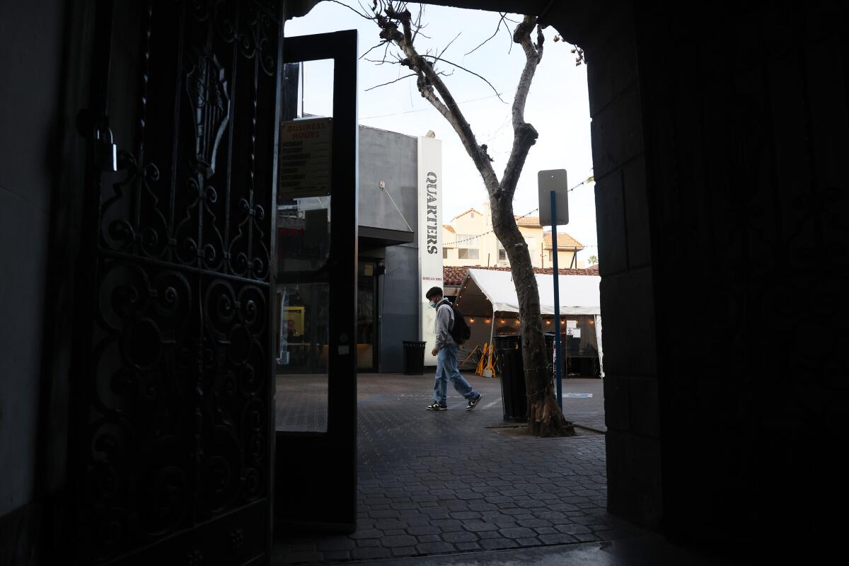 A person walks past Quarters restaurant 