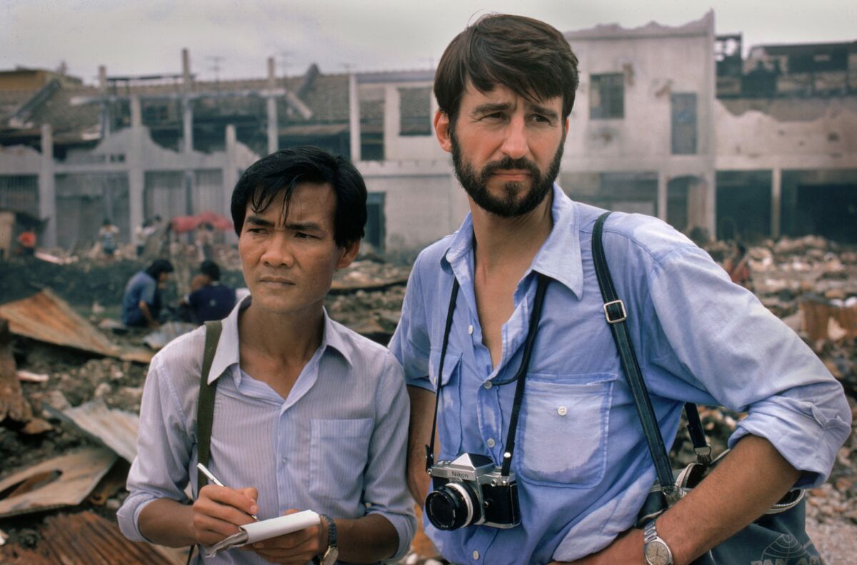 Haing S. Ngor, left, with Sam Waterston in the 1985 movie "The Killing Fields." (Warner Bros. Entertainment)