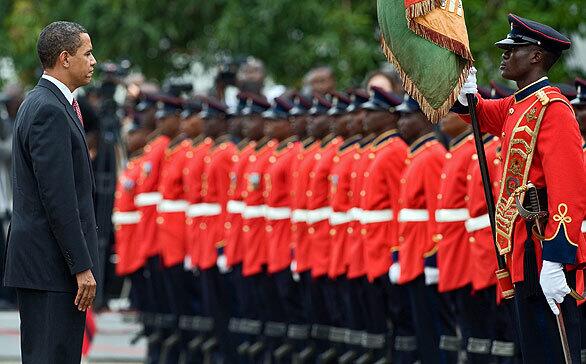 President Barack Obama reviews an honor guard at the Presidential Castle in Accra, the capital of Ghana. The visit marks his first visit to subs-Saharan Africa since becoming president. He said he chose Ghana because it was an example of a "functioning democracy" in the conflict-scarred continent.