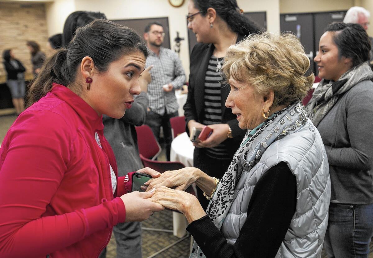 Holocaust survivor Edith Eva Eger speaks to Maria Elena Parada following Eger's presentation to the Jewish Law Society of Whittier Law School in Costa Mesa.