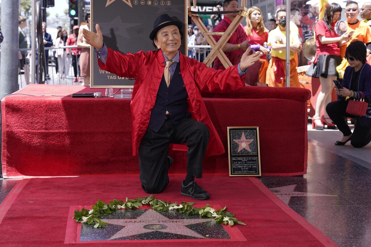 James Hong kneels at his Walk of Fame ceremony