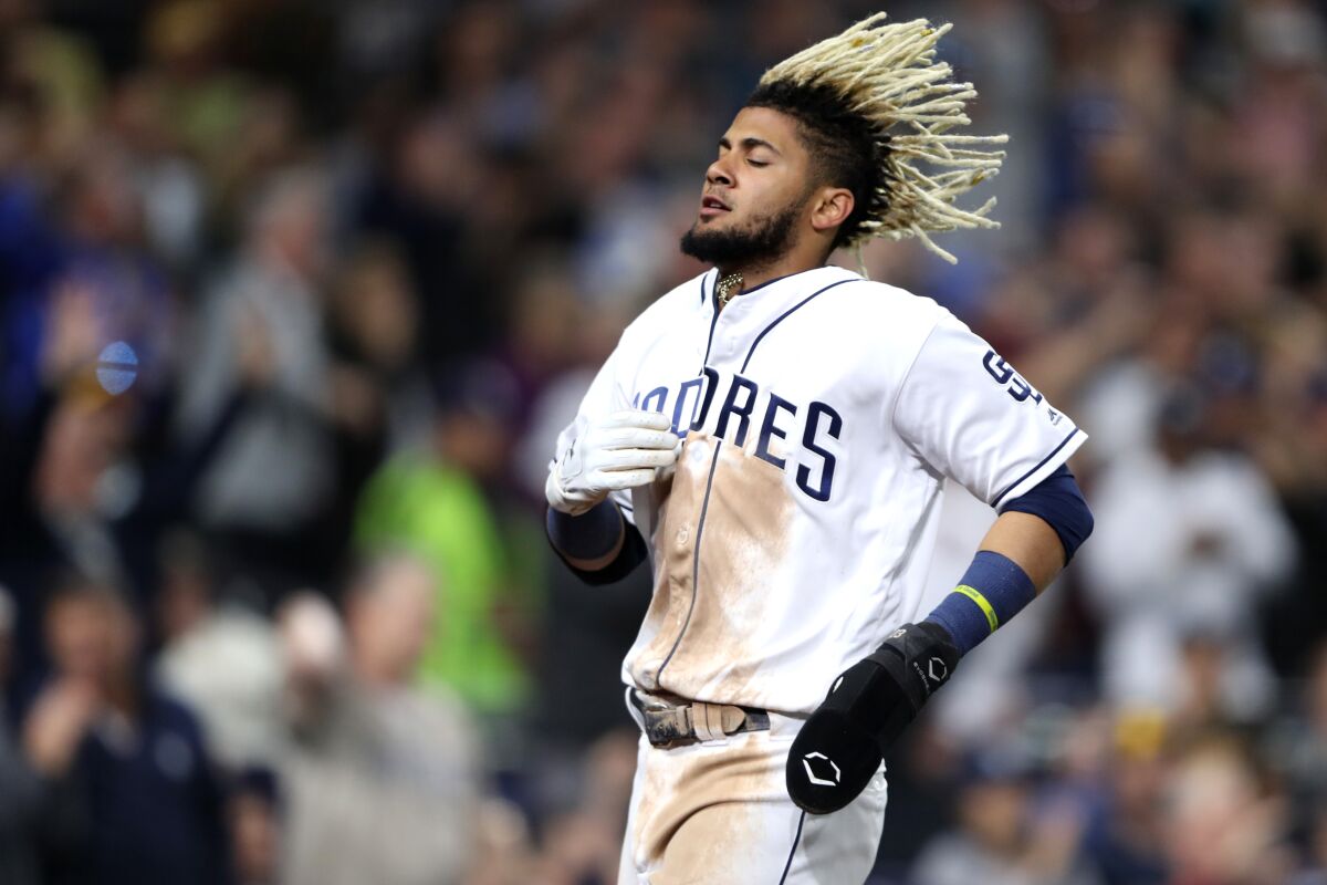 Fernando Tatis Jr. scores during a game against the Milwaukee Brewers on June 18.