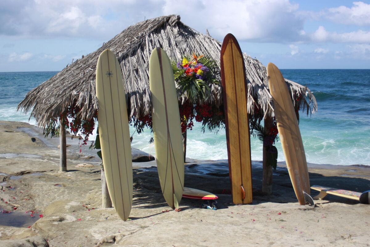 The Windansea surf shack is festooned with flowers and surfboards during a plaque ceremony March 20.