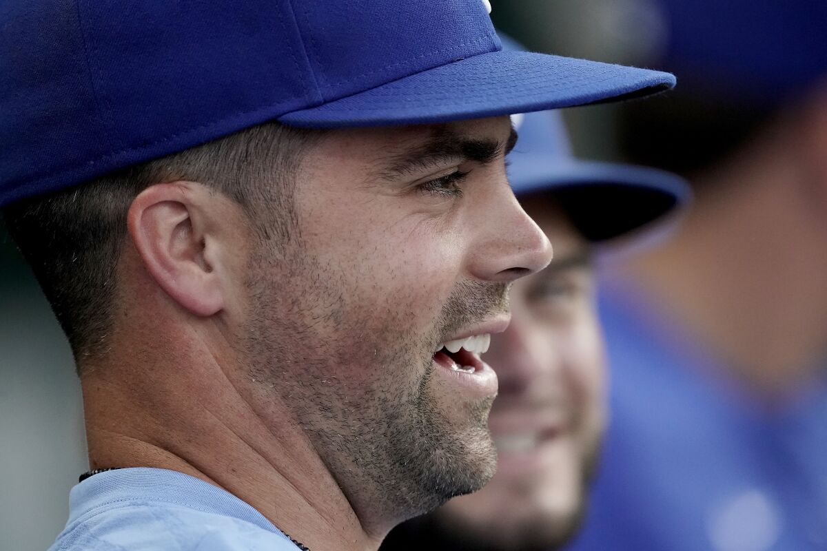 Kansas City Royals' Whit Merrifield watches from the dugout during the second inning of the second game of a baseball doubleheader against the Detroit Tigers Monday, July 11, 2022, in Kansas City, Mo. Today marked the first day Merrifield has missed playing after setting a Royals record of playing in 533 consecutive games. (AP Photo/Charlie Riedel)