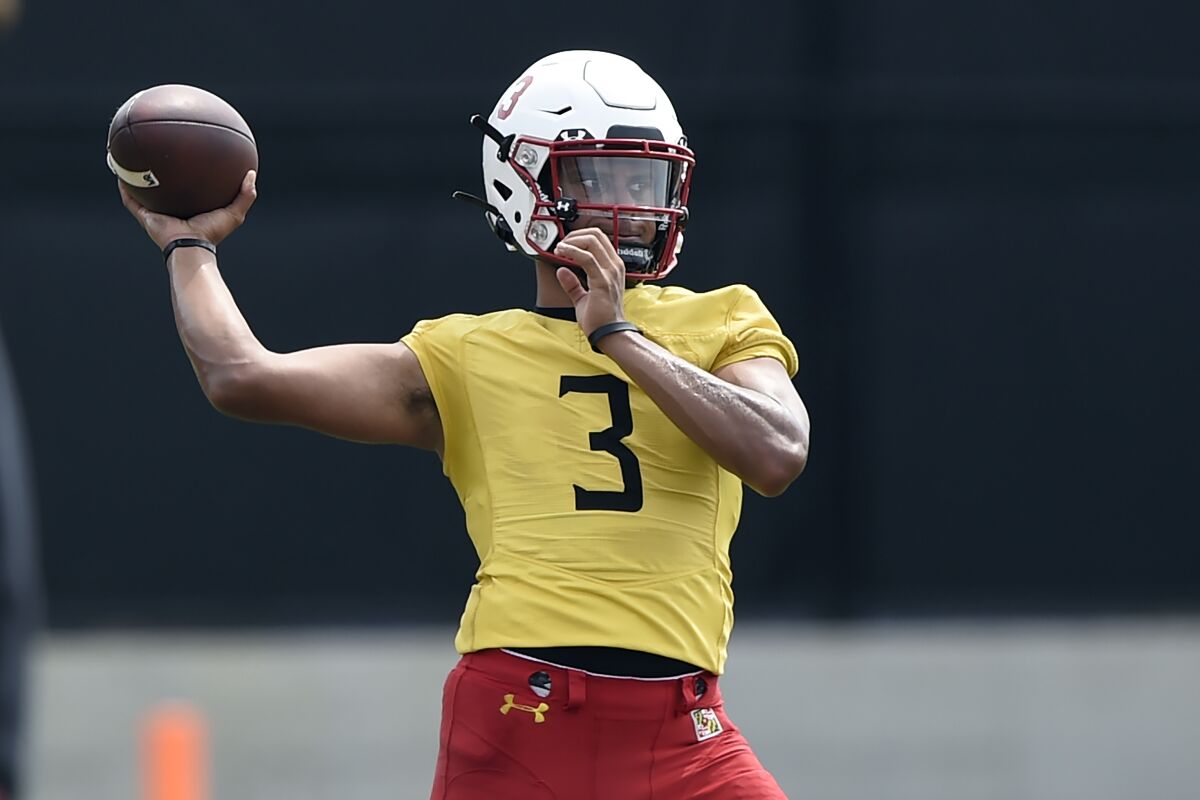 FILE - In this Aug. 6, 2021, file photo, Maryland football quarterback Taulia Tagovailoa throws during NCAA college football practice in College Park, Md. (AP Photo/Gail Burton, File)