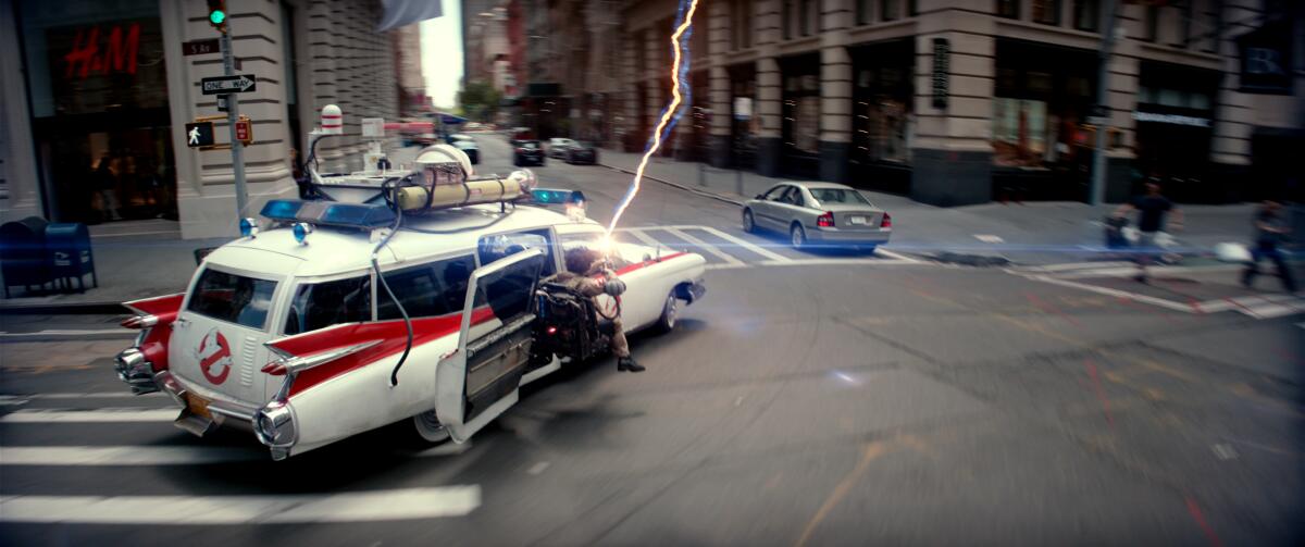 The Ecto-1 races through New York City in the movie "Ghostbusters: Frozen Empire."