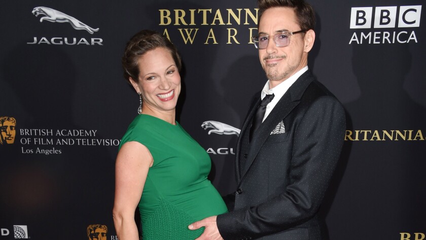 Robert Downey Jr. poses belly-to-belly with his wife, producer Susan Downey, at the BAFTA Los Angeles Jaguar Britannia Awards on Oct. 30. They welcomed their second child, a baby girl, on Nov. 4.