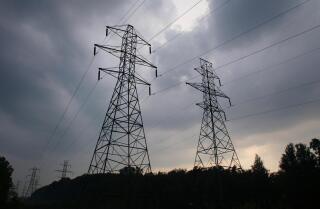 Power transmission lines are shown in Lansing, Mich., against a sky of gathering storm clouds Thursday, Aug. 21, 2003. State regulatory officials lost much of their ability to force upgrades in the power grid when the transmission lines that carry that electricity for areas served by the state's two major utilities, Detroit-based DTE Energy and Jackson-based Consumers Energy Co., were bought by private companies. (AP Photo/Al Goldis) ***** PUB. WITH GRAPHIC ***** Graphic by The Morning Call Sources: Wall Street Journal, Associated Press, Washington Post ***** ENERGY SAVINGS --- Those interested in greener and cheaper living could benefit from the energy bill that passed the House in Thursday. ** Standards for power companies designed to avoid balckouts ***** Headline: It's saving-energy time, so extension sees daylight ** House bill adds a month. Here are some pros and cons. (7/29/05) ***** MEMO: Please see microfilm for complete graphic *****