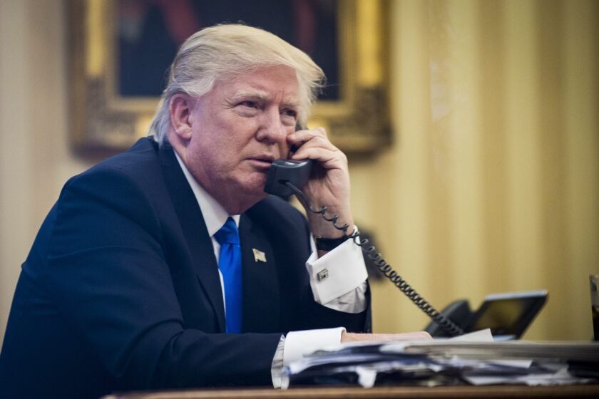 epa05758039 US President Donald J. Trump speaks on the phone with Prime Minister of Australia, Malcolm Turnbull, in the Oval Office in Washington, DC, USA, 28 January 2017. The call was one of five calls with foreign leaders scheduled for 28 January. EPA/PETE MAROVICH / POOL ** Usable by LA, CT and MoD ONLY **