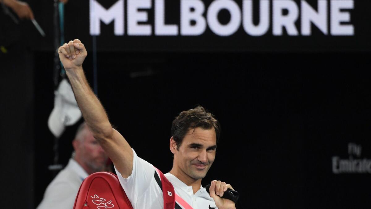 Roger Federer waves after Hyeon Chung retired from their men's singles semifinal match at the Australian Open on Jan. 26.