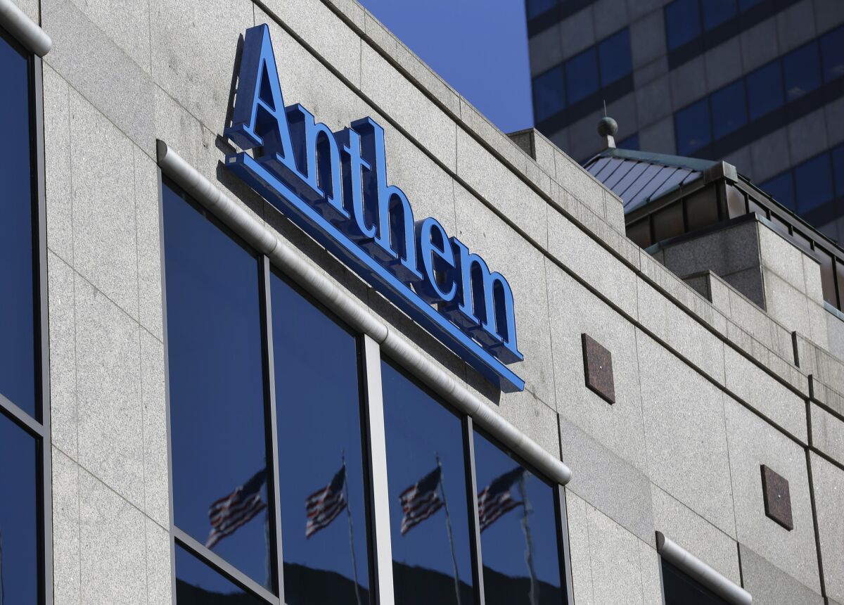 The Anthem logo hangs at the health insurer's corporate headquarters in Indianapolis on Feb. 5, 2015. The company was in the news earlier this year when hackers broke into its database storing information for about 80 million people.