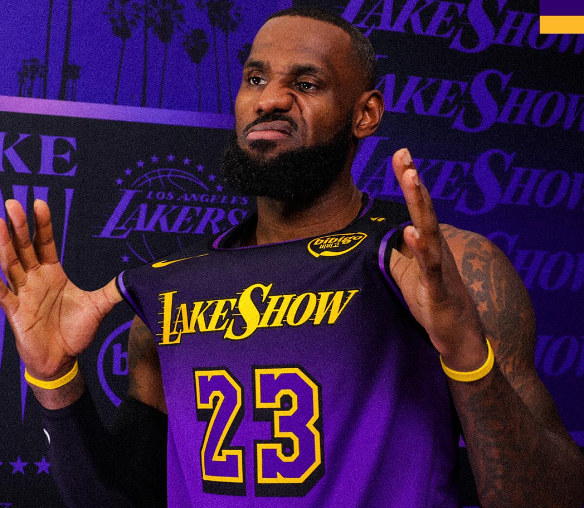 LeBron James makes a funny face as he tries on the "Lake Show" uniform.